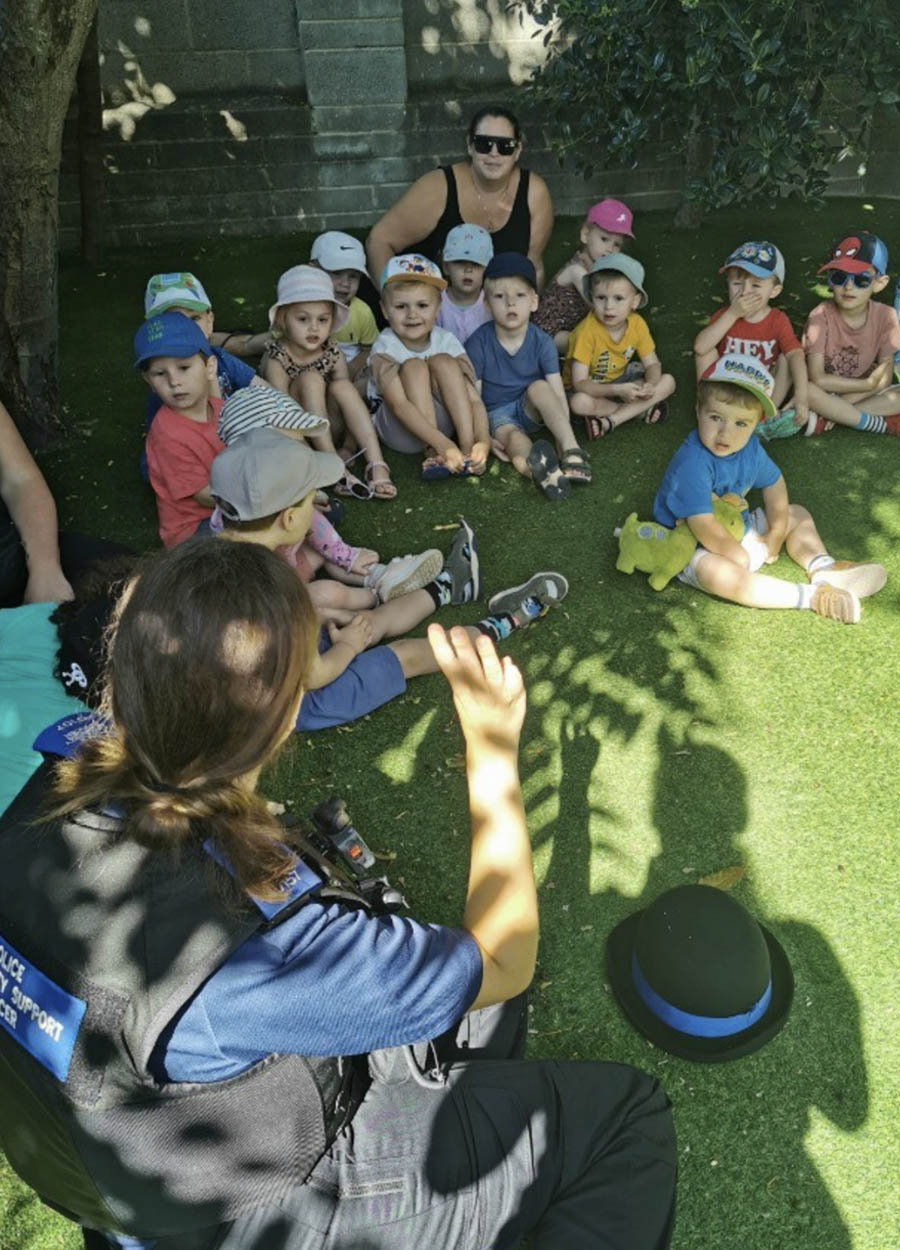A member of the playaway day nursery team and a child at the nursery graduation